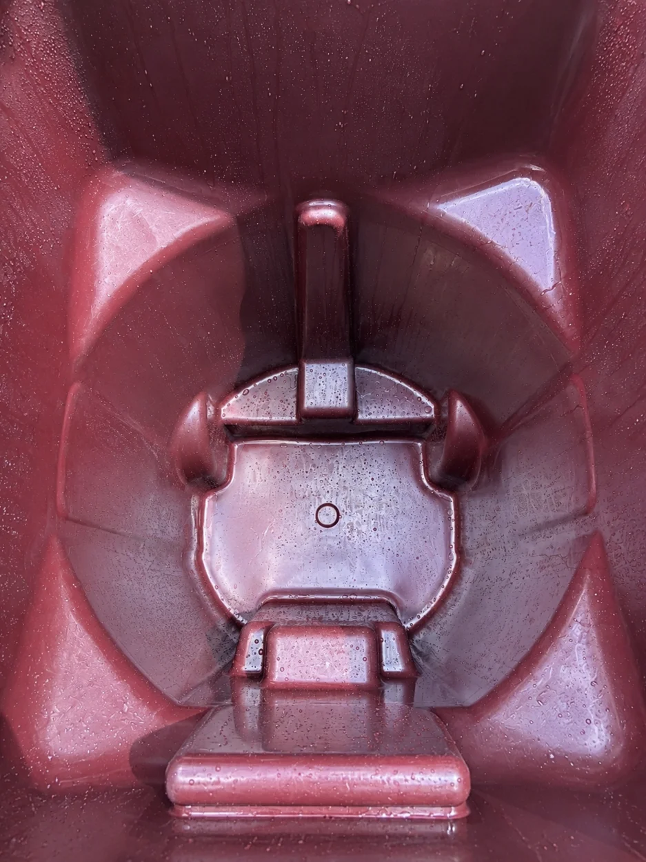 Red residential bin after cleaning